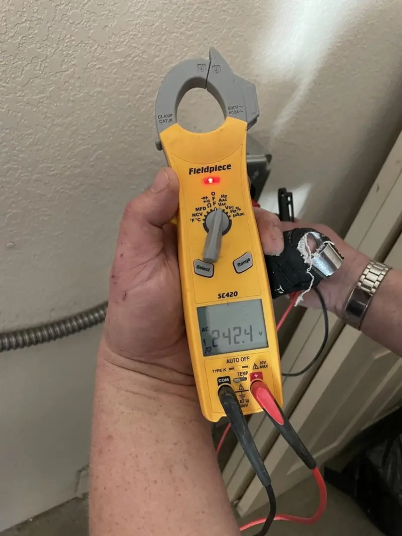 Voltage testing with clamp meter during Ceiling Fan Installation in Boonville
